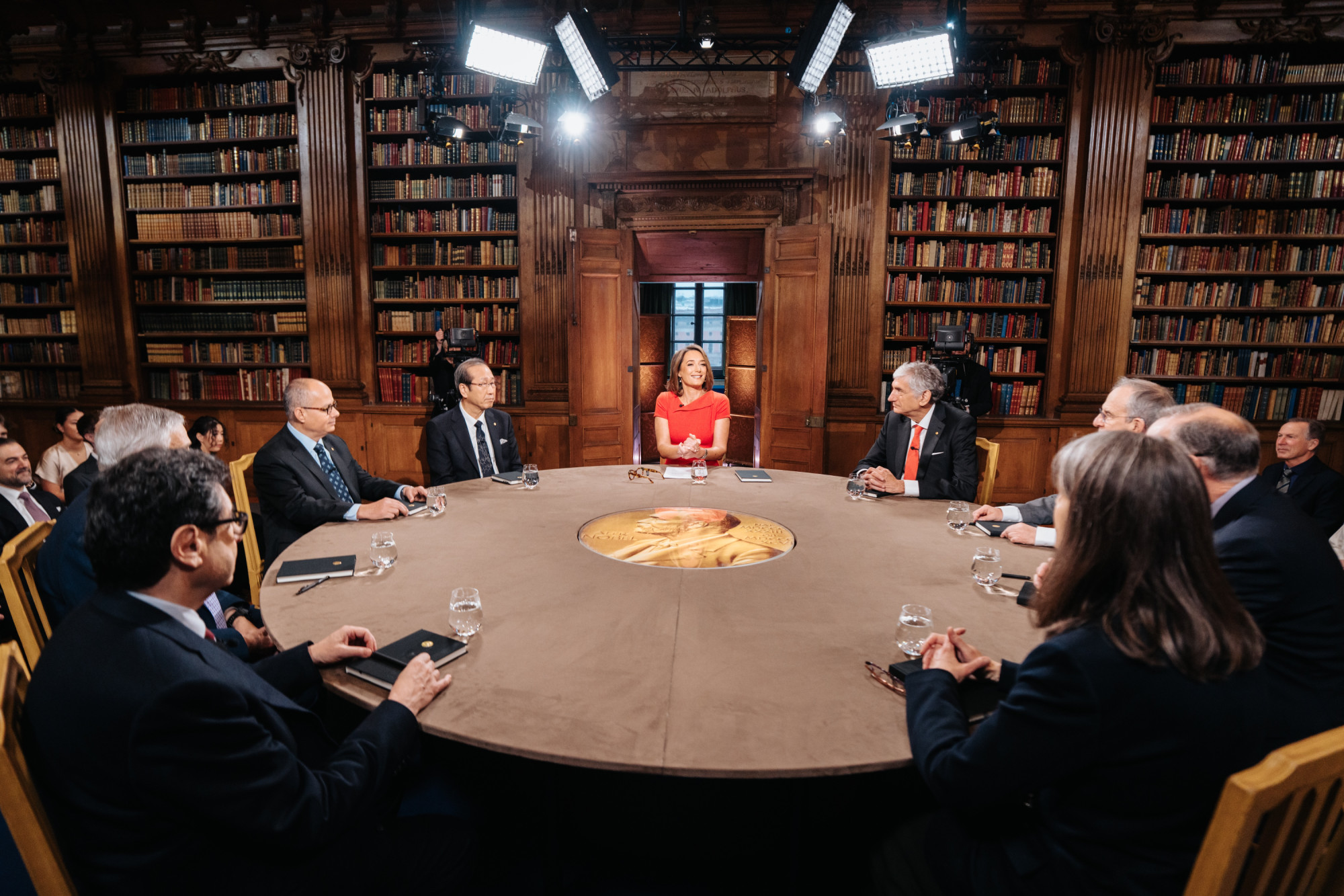 People gathered at round-table discussion